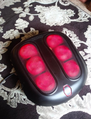 the heating nodes visible on the massager