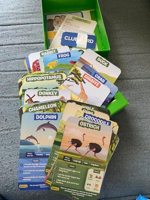 An animal-themed card game featuring a variety of animals, such as giraffes, dolphins, and ostriches, each accompanied by fun facts and unique features.