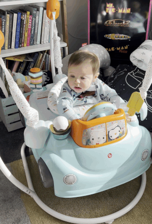 A gif of the editor’s baby jumping inside an ice cream truck-themed bouncer.