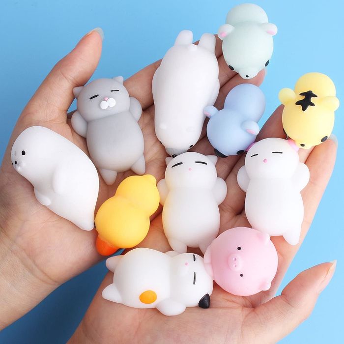 hands gripping squishy stress relievers