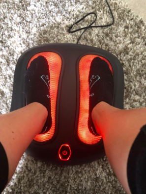 reviewer picture of them using the foot massager