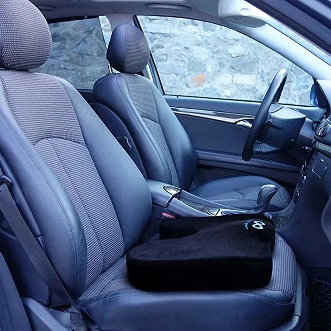 A seat cushion resting on a car seat, offering comfort on the go.