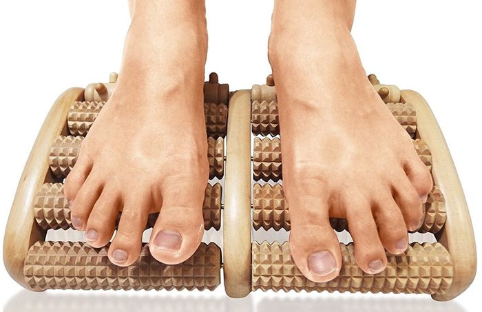 feet rolling over the foot massager