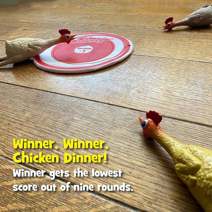 Toy chickens placed around a disc on a wooden floor. Text reads