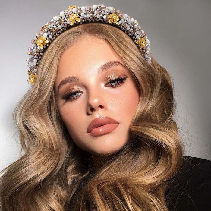 A model showcasing the pearl-white headband.