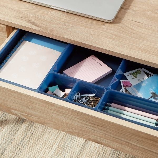The bin set keeping items neat inside a drawer