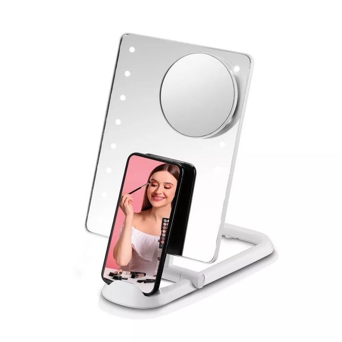 A vanity mirror showcasing a model applying makeup, with the demonstration displayed on a smartphone screen.