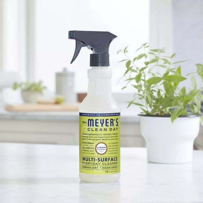 A spray bottle sitting on a kitchen counter.