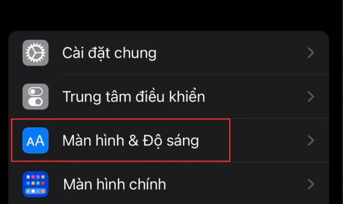 Truy cập vào phần Cài đặt của điện thoại, chọn mục Màn hình & Độ sáng
