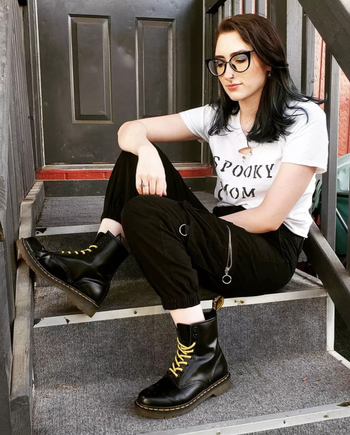A model wearing the black boots.
