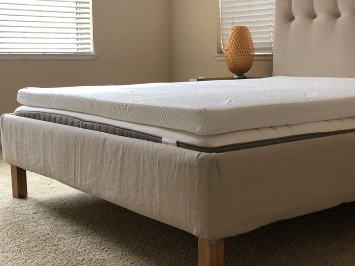 reviewer image showing the mattress topper on a mattress