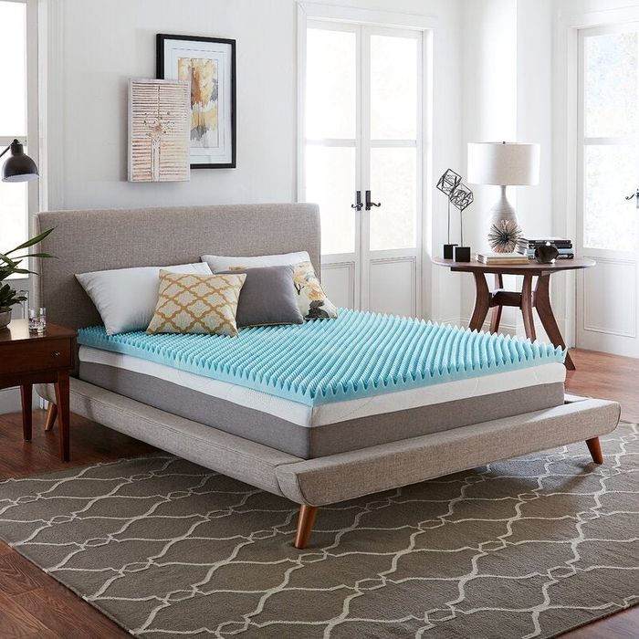 A topper designed for a full-sized bed for added comfort.