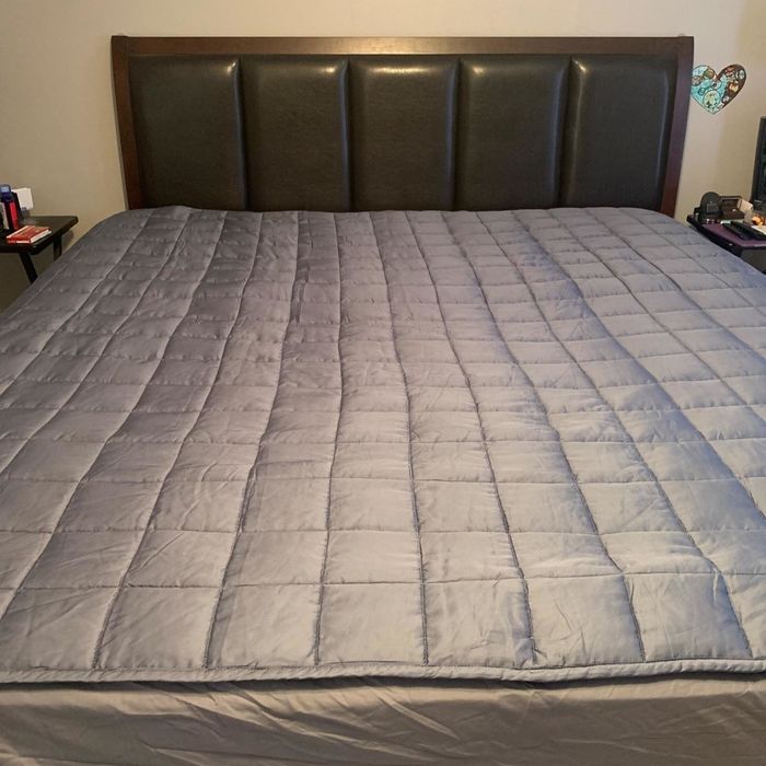 Image of weighted blanket on bed from a reviewer