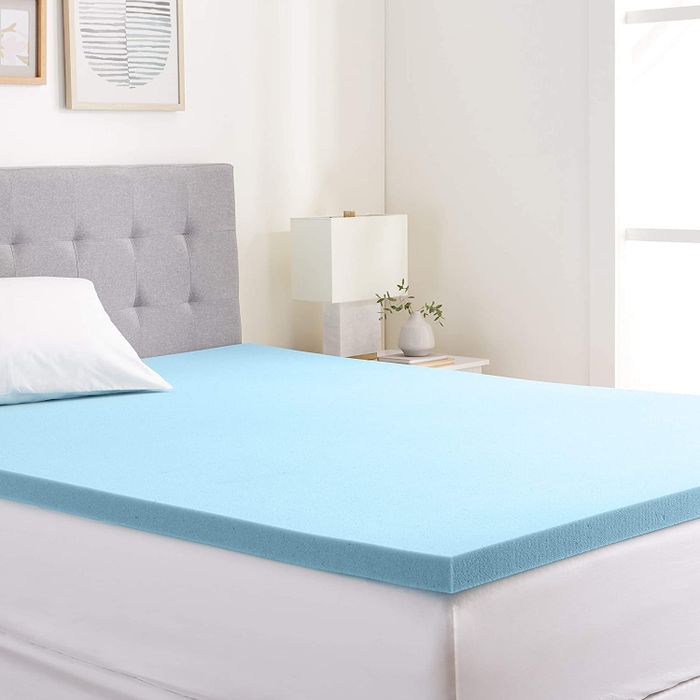 Place a blue mattress topper on your mattress for improved comfort.