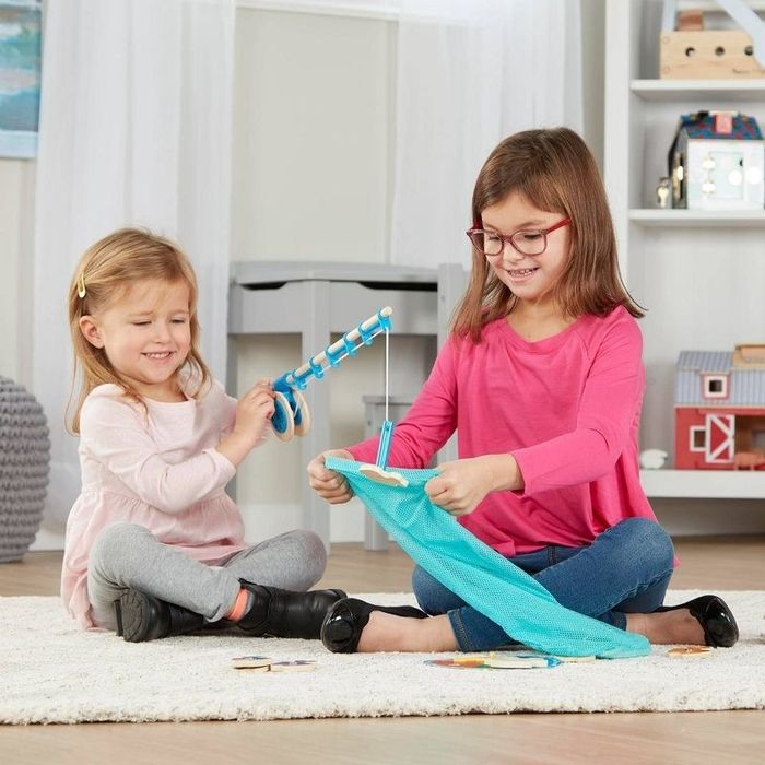 Children having fun with the fishing game