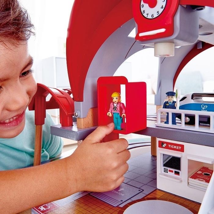 Child playing with a train set