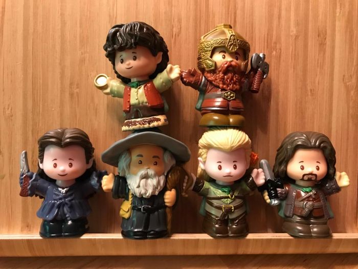 a collection of Little People figures from Lord of the Rings