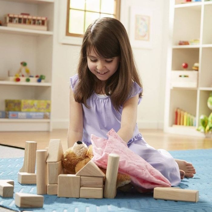 A child enjoying playtime with blocks.