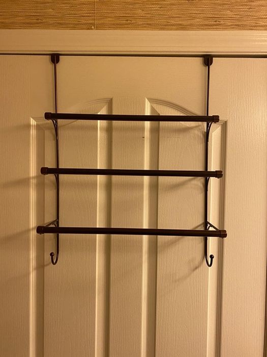 Reviewer's towel holder hangs from a door