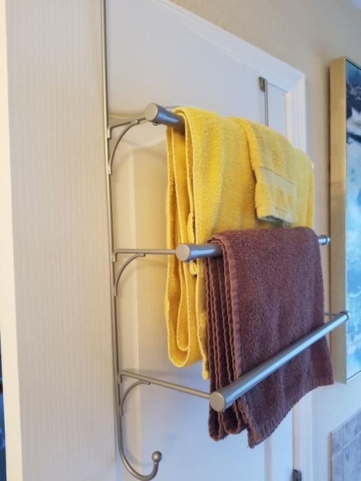 The towel rack is shown with two towels hanging off of it