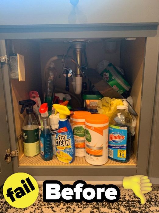A reviewer's disorganized cabinet before adding the shelf