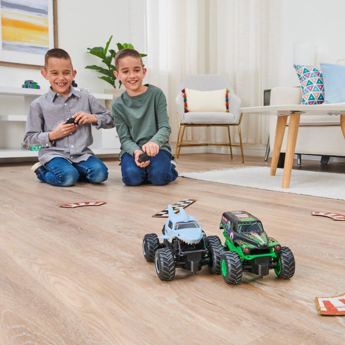 Children playing with monster trucks