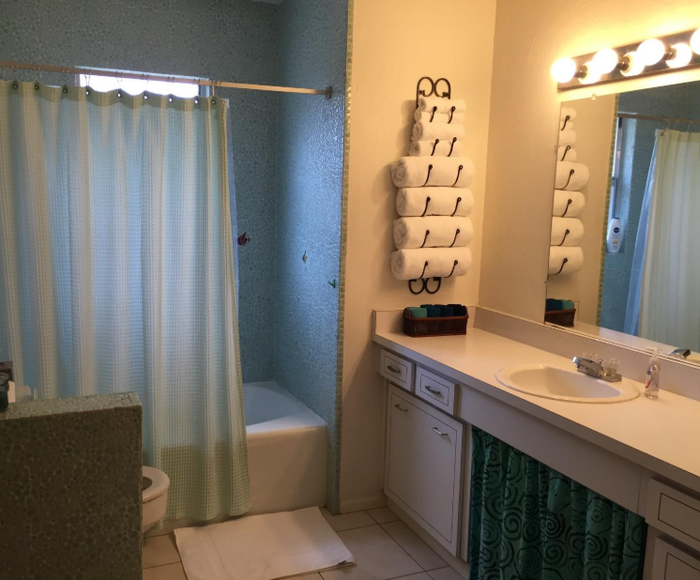 Reviewer photo displaying a towel rack filled with towels in multiple sizes