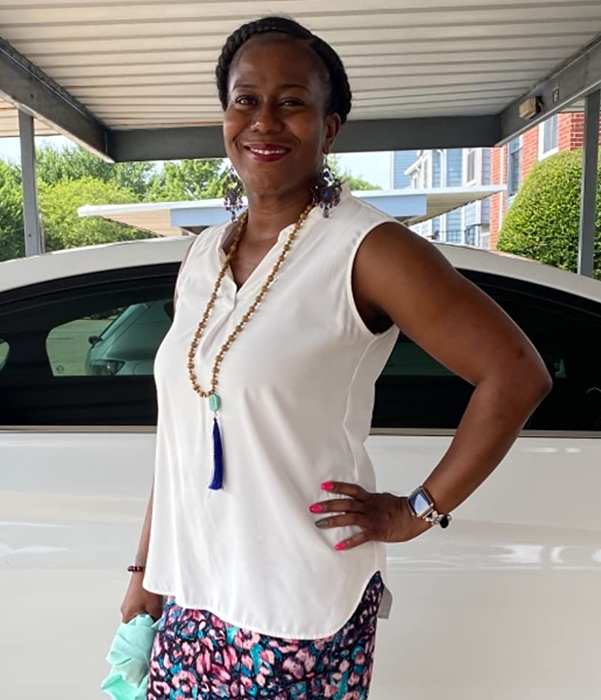 Photo of reviewer wearing a white blouse.