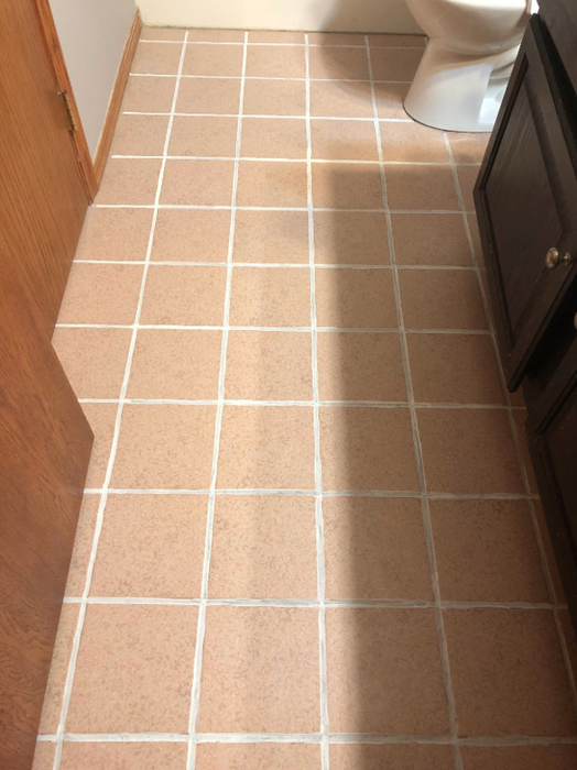 Photo from a reviewer showing the same tiles after using the grout ink pen.