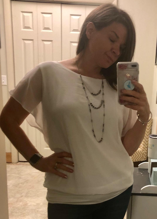Image of reviewer wearing the white blouse