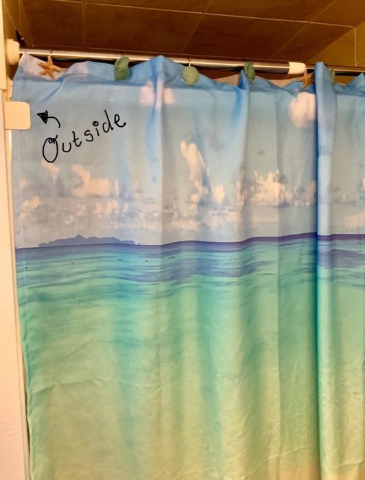 A photo of the clip installed on a reviewer's shower.