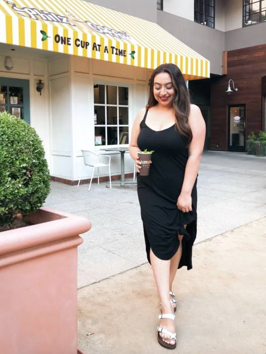 reviewer showcasing the black dress