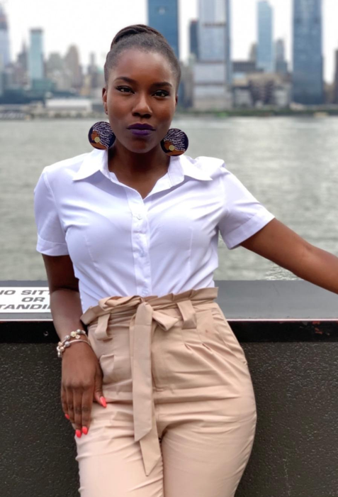 Image of reviewer wearing the white shirt paired with beige pants