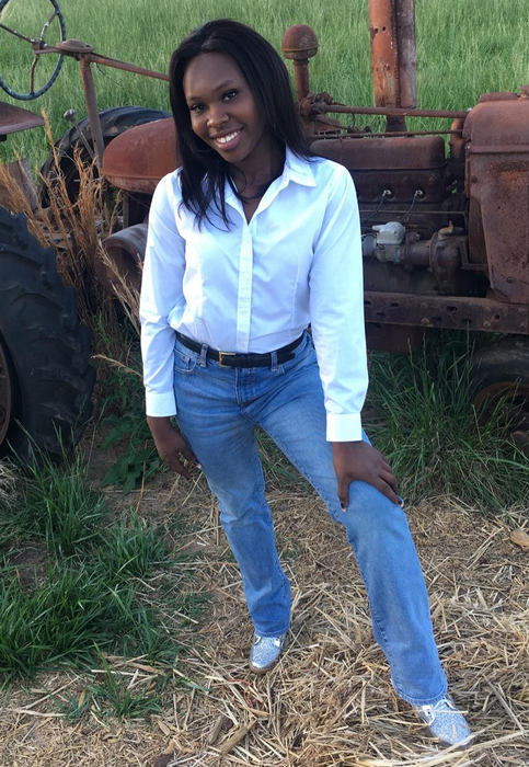 Reviewer sporting a white button-up shirt paired with jeans