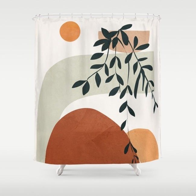 A white shower curtain featuring colorful shapes in green, brown, and tan, along with a beautiful leaf illustration