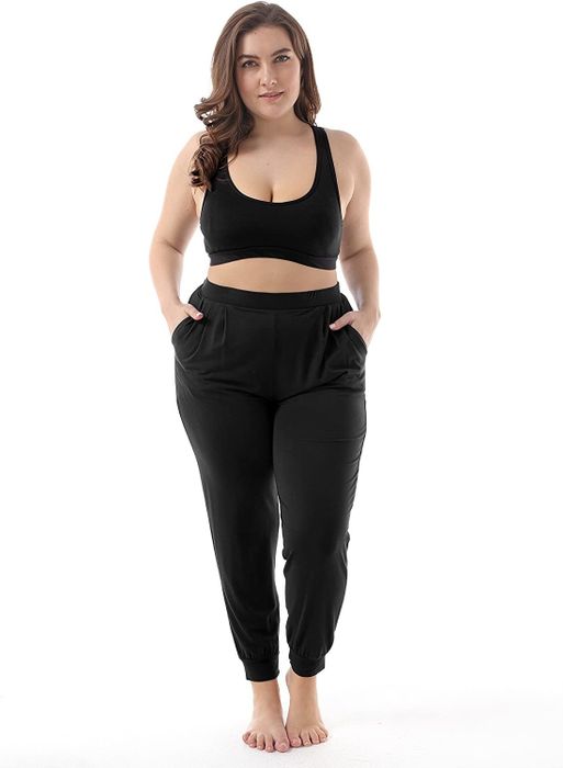 A model showcasing the sleek black joggers