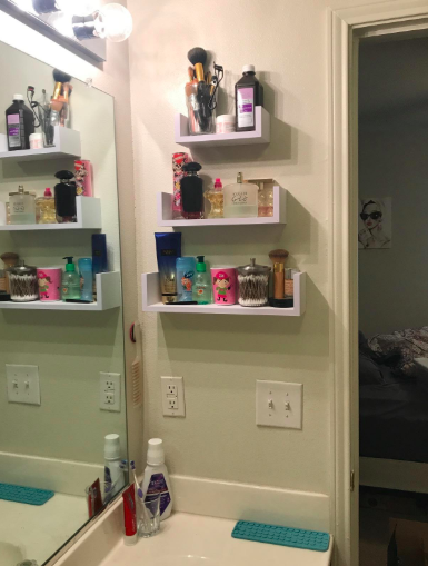 A photo from a reviewer showcases floating shelves mounted on a bathroom wall.