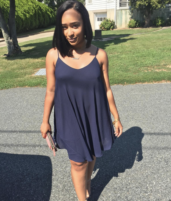 reviewer showcasing the navy blue dress