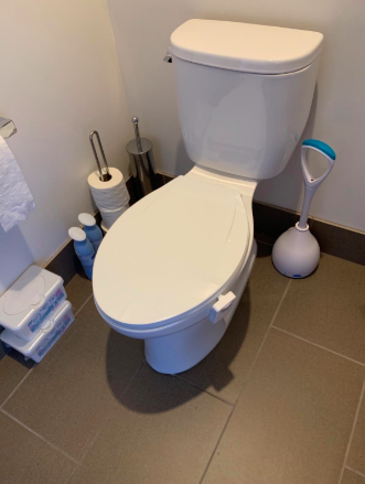 A reviewer's photo showing a closed toilet.