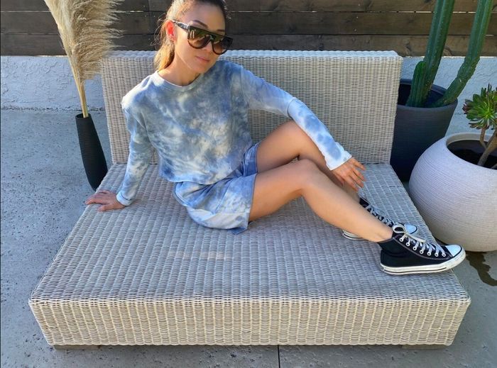 A model styled in the trendy blue tie-dye short set