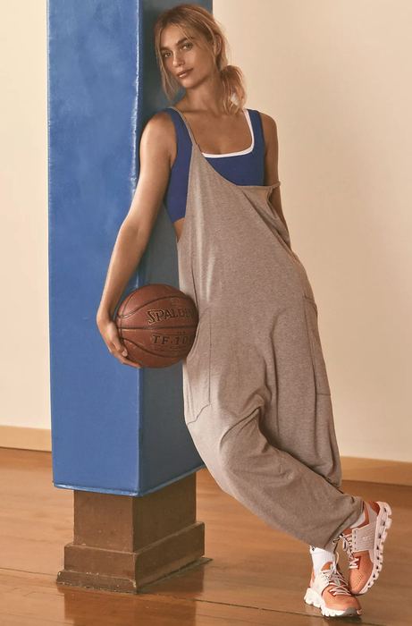 a model showcasing the onesie in a stylish gray shade