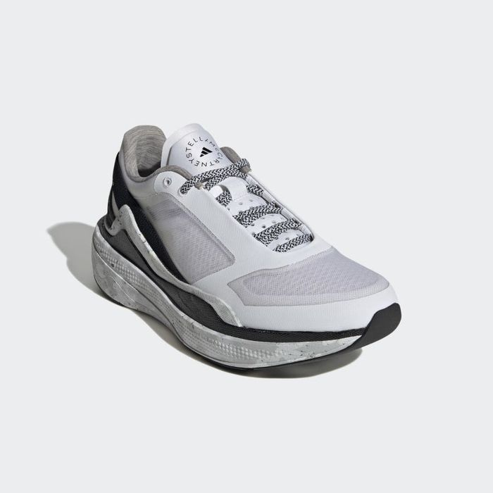 A frontal view of the shoes featuring a blend of grey and black colors.