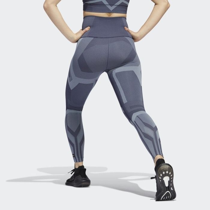 Back view of the model showcasing the graphic grey/blue tights.