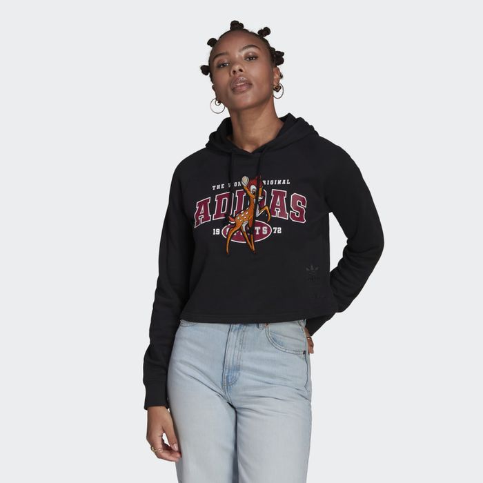 A model wearing the black hoodie with Bambi stitched across the text that says