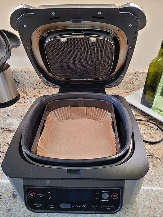 Reviewer image of a paper air fryer liner placed inside an air fryer