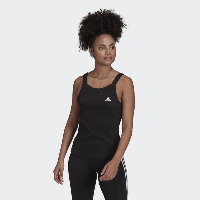 Front view of the model wearing the black tank top.