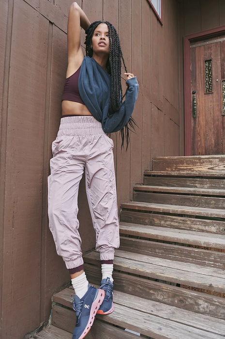 The model is wearing the joggers in lilac.