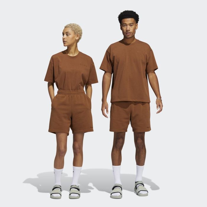 two models wearing the unisex shorts in brown