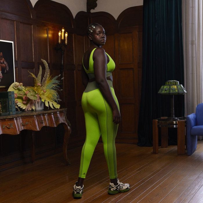 Back view of the model showcasing the long green tights.