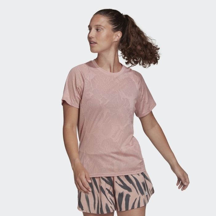 Front view of the model wearing the pink floral-patterned shirt.